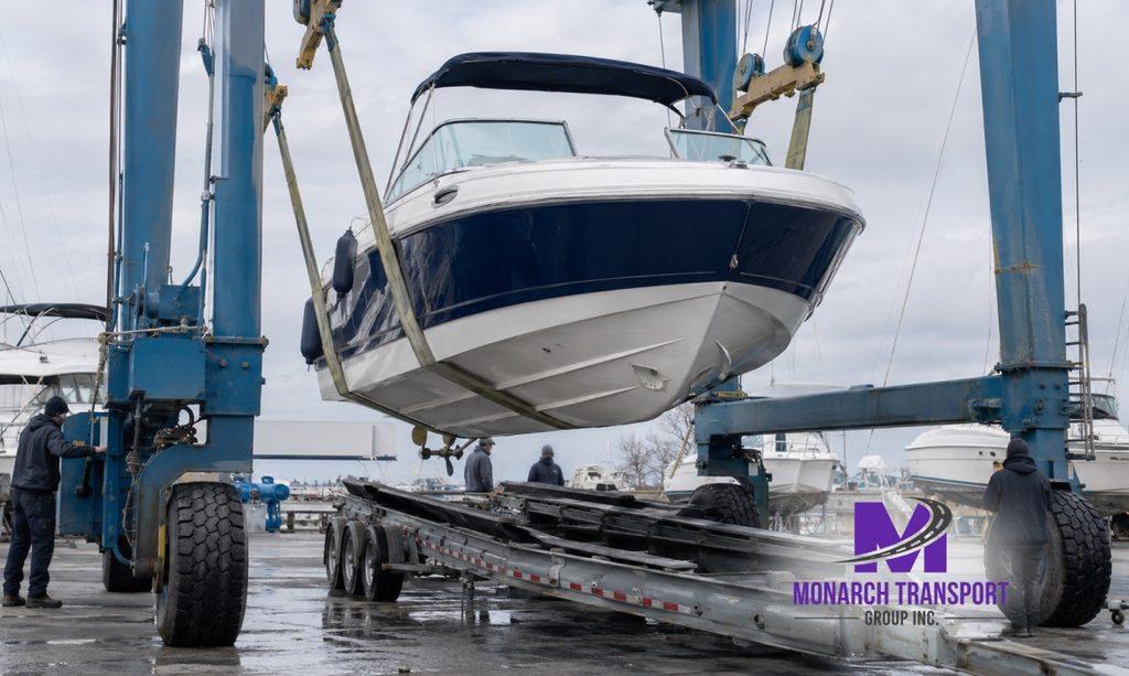  Boat being lifted onto transport equipment with a marina travel lift